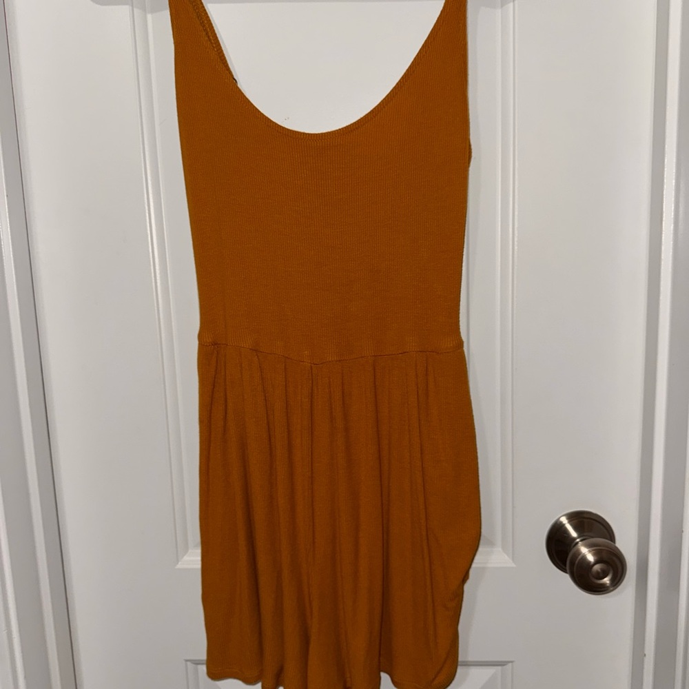 Mustard Romper With Adjustable Straps And Pockets